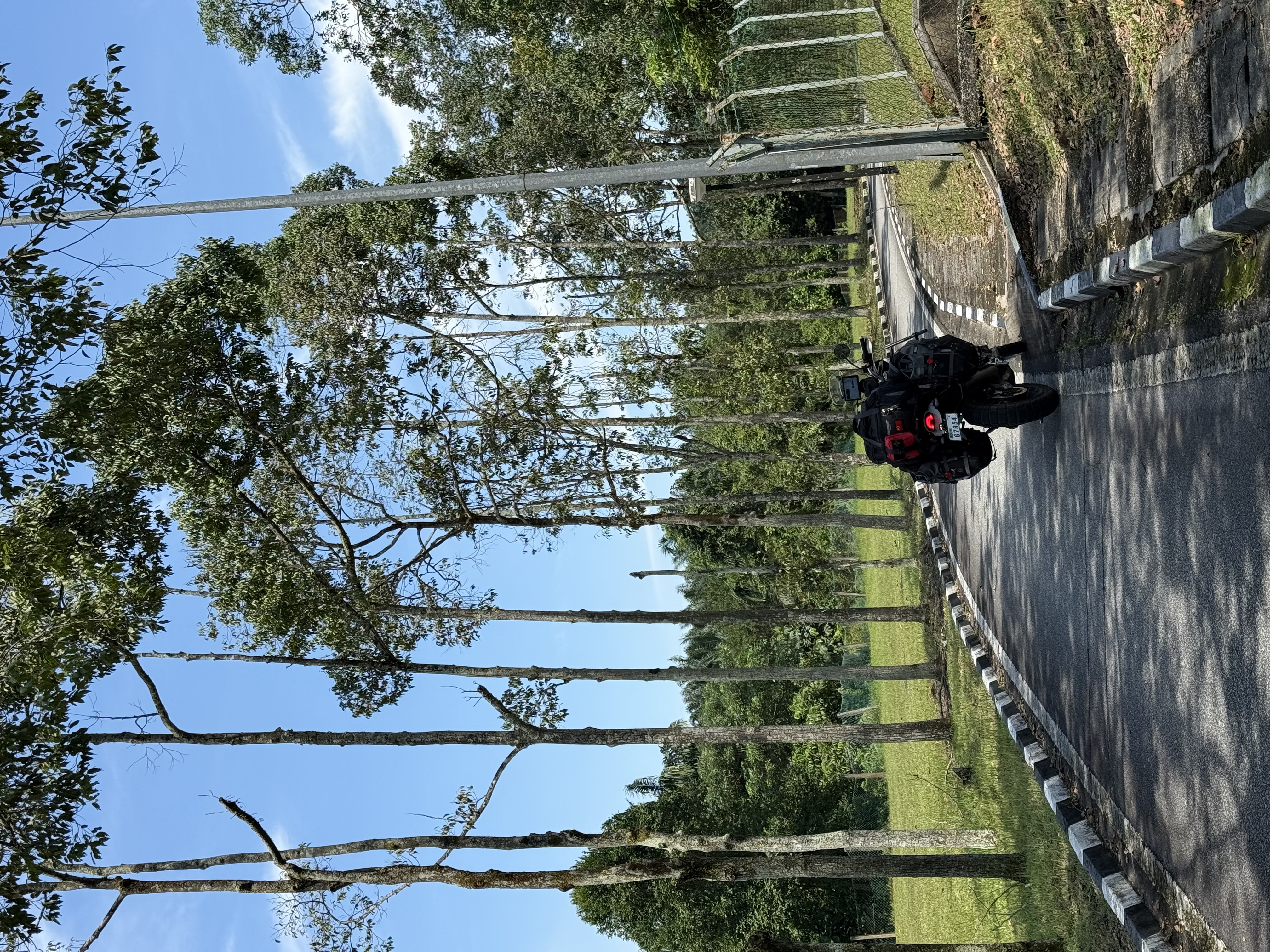 at a toll gate (bikes get a bypass lane) on the way to JB